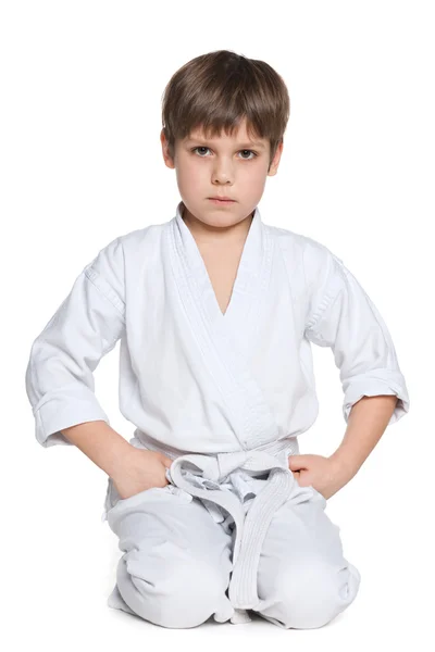 Little boy in kimono sits on the floor — Stock Photo, Image