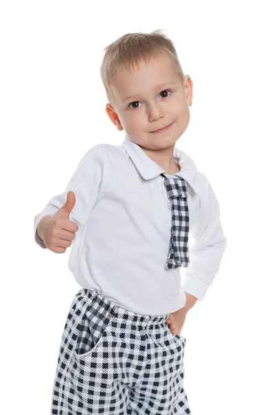 Fashion little boy holds his thumb up — Stock Photo, Image