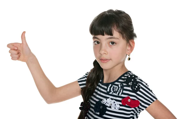 Młoda dziewczyna trzyma jej kciuk — Zdjęcie stockowe