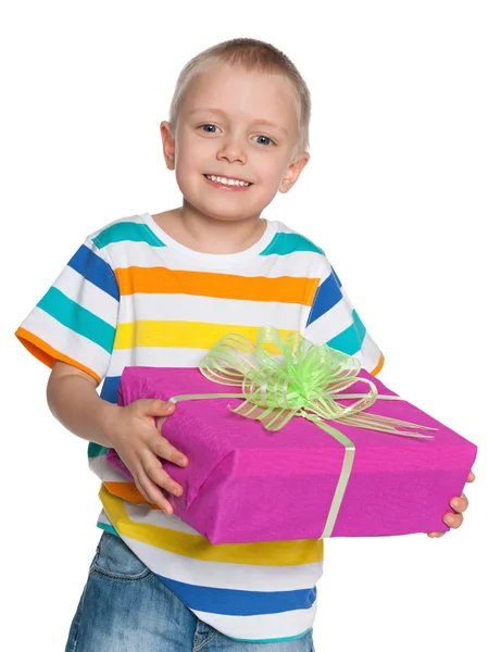 Happy young boy with a gift box — Stock Photo, Image