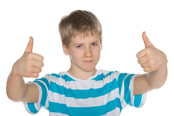 Preteen boy holds his thumbs up — Stock Photo, Image