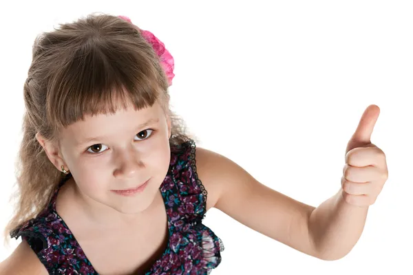 Bonita niña sostiene su pulgar hacia arriba —  Fotos de Stock