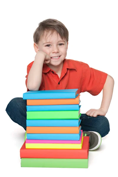 Lachende jongen met boeken — Stockfoto