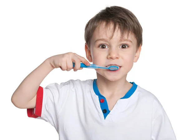 Young boy brushing her teeth — Stock Photo, Image