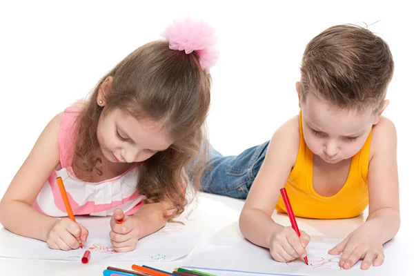 Happy children drawing on paper Royalty Free Stock Images