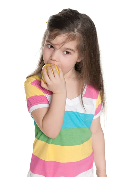 Little girl eats an apple — Stock Photo, Image