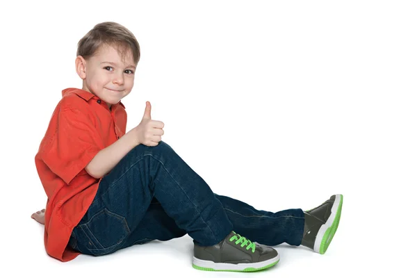 Smiling preschool boy with his thumb up — Stock Photo, Image