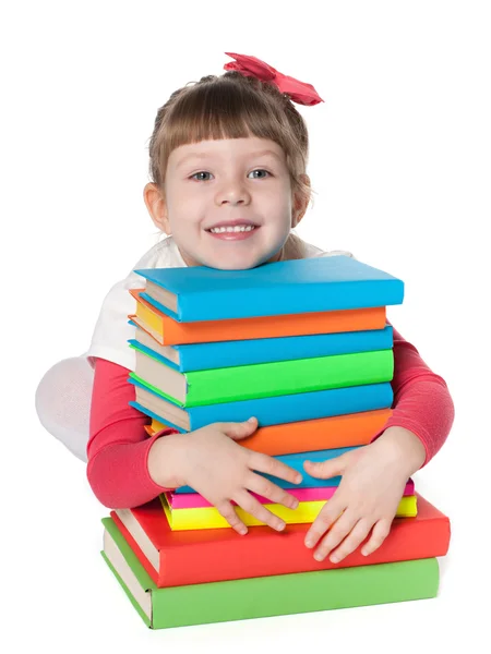 Mądra dziewczynka w pobliżu książek — Zdjęcie stockowe