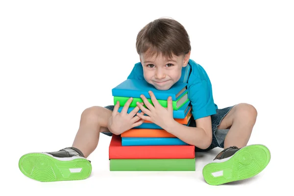 Very clever little boy with books — Stock Photo, Image