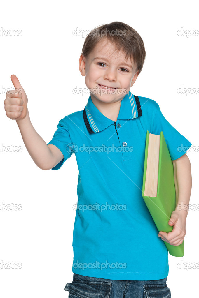 Little boy with book holds his thumb up