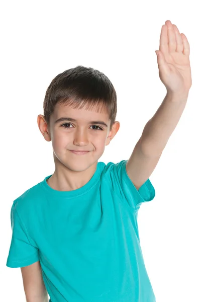 Jonge jongen uitrekken zijn rechterhand omhoog — Stockfoto