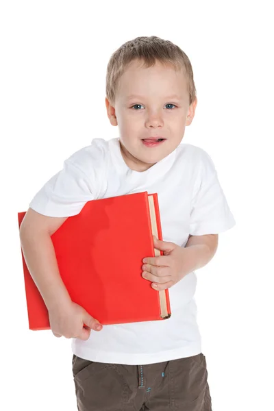 Schattige preschool jongen met een boek — Stockfoto