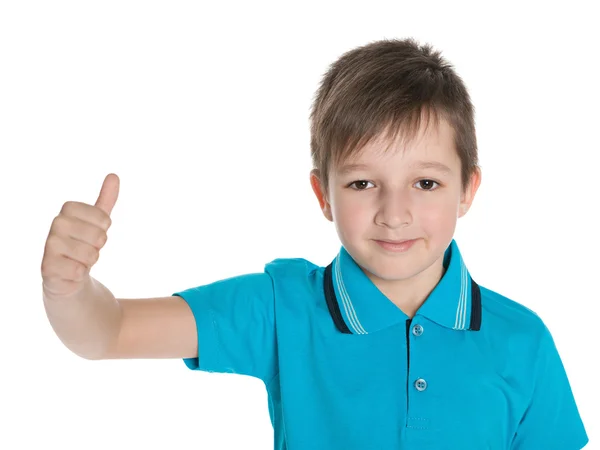 Niño en la camisa azul sostiene su pulgar hacia arriba — Foto de Stock
