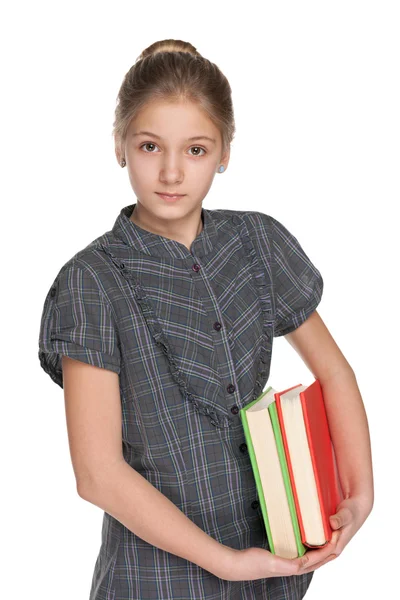 Clever girl holds books — Stock Photo, Image