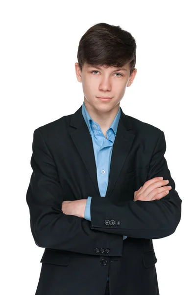 Bonito adolescente menino em um terno preto — Fotografia de Stock