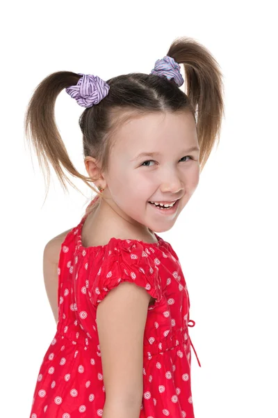 Happy little girl looks back — Stock Photo, Image