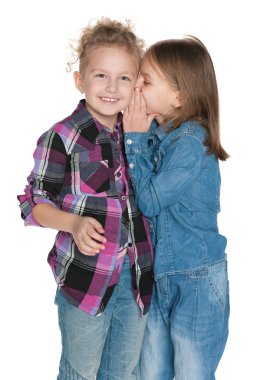 Young girl whispers something to her friend clipart