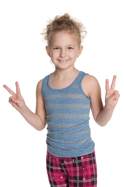 Young girl shows a victory sign — Stock Photo, Image