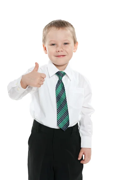 Little schoolboy holds his thumb up — Stock Photo, Image