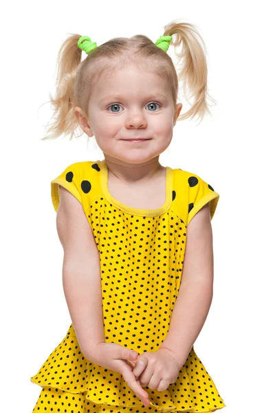 Маленькая девочка в жёлтом платье Стоковая Картинка