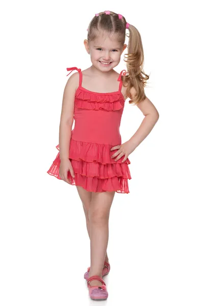 Klein meisje in de rode jurk — Stockfoto