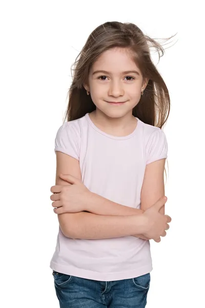 Lovely little girl against the white — Stock Photo, Image