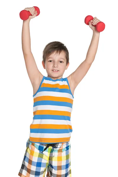 Young boy with dumbbells — Stock Photo, Image