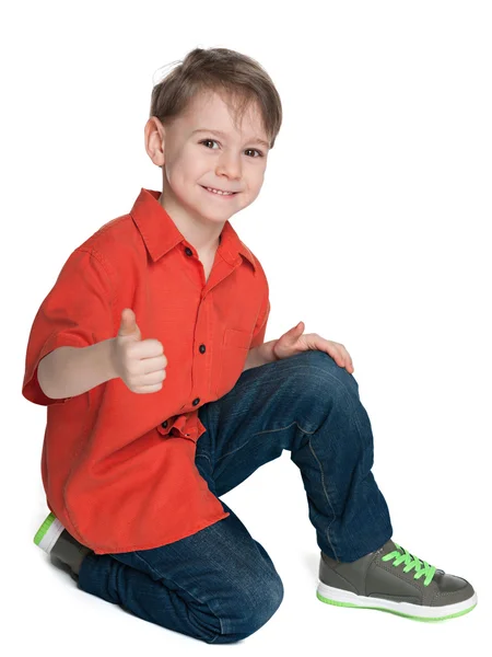 Sorridente ragazzo carino con il pollice in su — Foto Stock