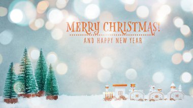 Noel, yeni yıl geçmişi. Oyuncak trenli ve yazılı tebrik kartı. Mutlu Noeller.