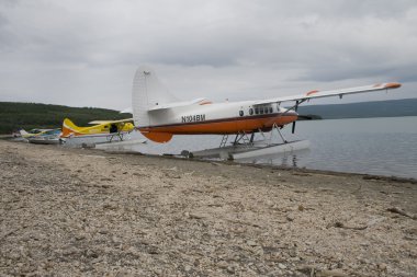 Float planes parked on Naknek Lake in Katmai National Park clipart