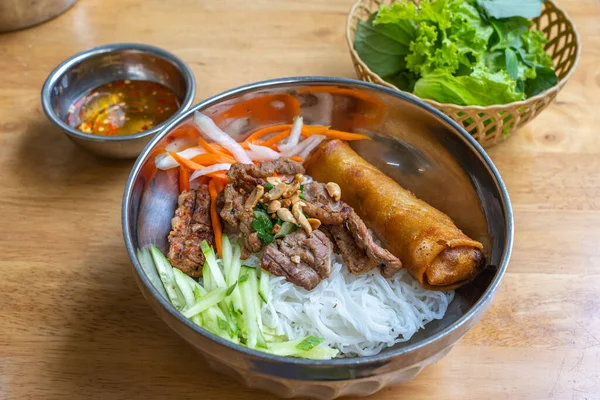 Famous Vietnam food with rice noodles, grill pork and vegetable