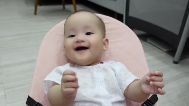 Smiling and cute baby sitting and laughing — Stock Video