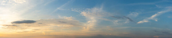 Panorama photo of sunset cloudy sky background. High quality photo