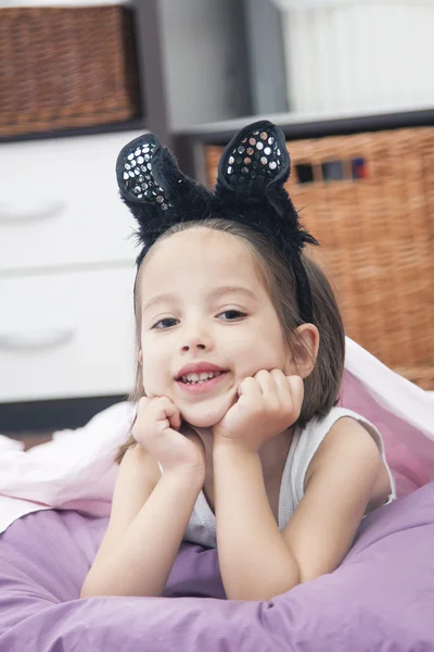 Little girl with kitten ear — Stock Photo, Image