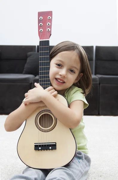 Little artist with guitar Stock Image