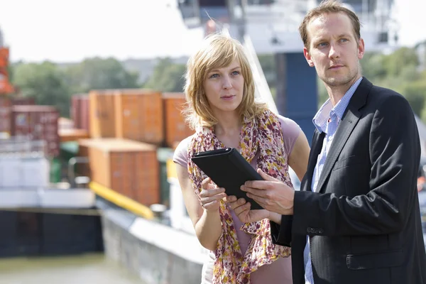 Colleagues with digital tablet looking away — Stock Photo, Image