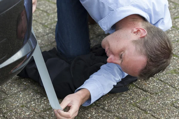 Man Using Duct Tape To Fix Car. — Stock Photo, Image