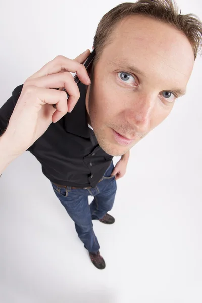 Mid adult man using cell phone — Stock Photo, Image