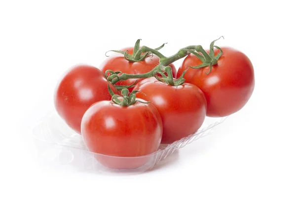 Verse tomaten geïsoleerd op een witte achtergrond in transparant lade — Stockfoto