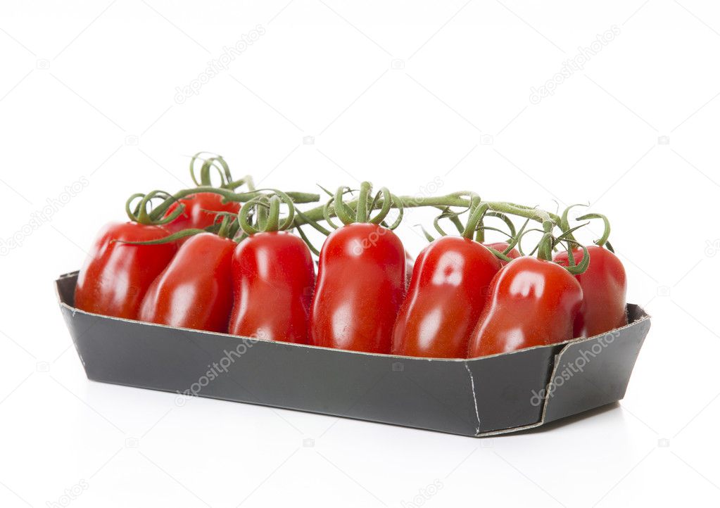 Fresh tomatoes isolated on white background in black tray