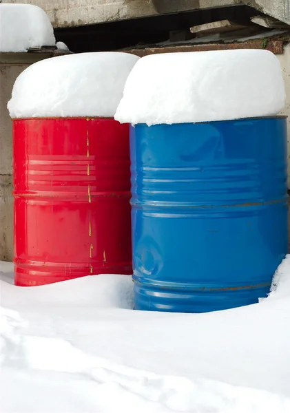 Iron barrels in the snow — Stock Photo, Image