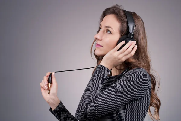 Girl in headphones — Stock Photo, Image