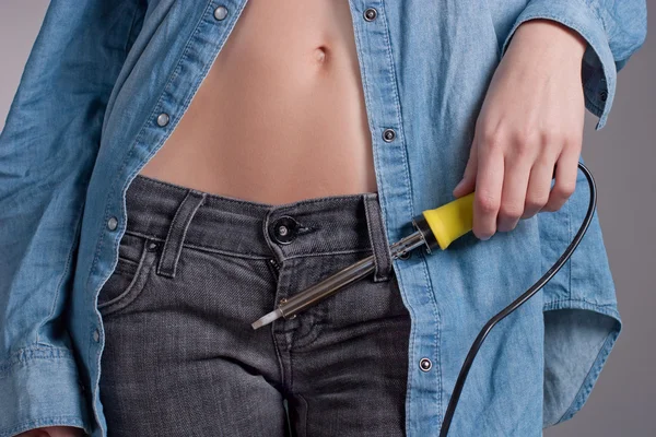 Girl with a soldering iron — Stock Photo, Image