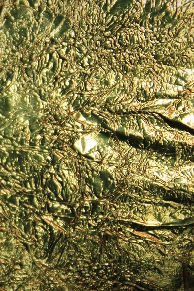 Goldene Folie zerrissen Oberfläche — Stockfoto