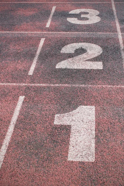 Numbers on running track — Stock Photo, Image