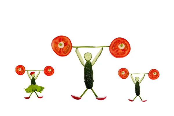 Gesunde Ernährung. Lustiges bisschen von den Gurkenscheiben heben — Stockfoto
