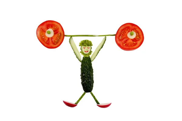 Gezond eten. grappige kleine man van de plakjes komkommer — Stockfoto
