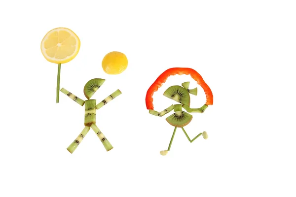 Healthy eating. Funny little people of the kiwi slices. — Stock Photo, Image