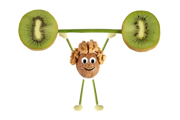 Zdrowe odżywianie. Zabawny człowiek mały orzech podnosi kiwi bar — Zdjęcie stockowe