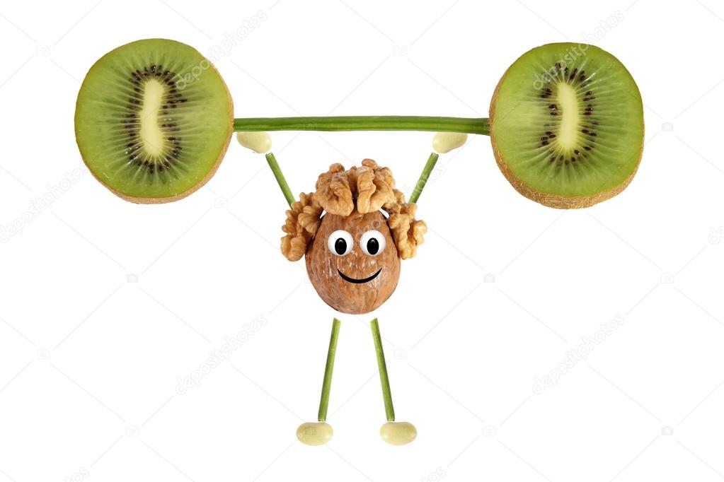 Healthy eating. Funny little man of the walnut raises kiwi bar